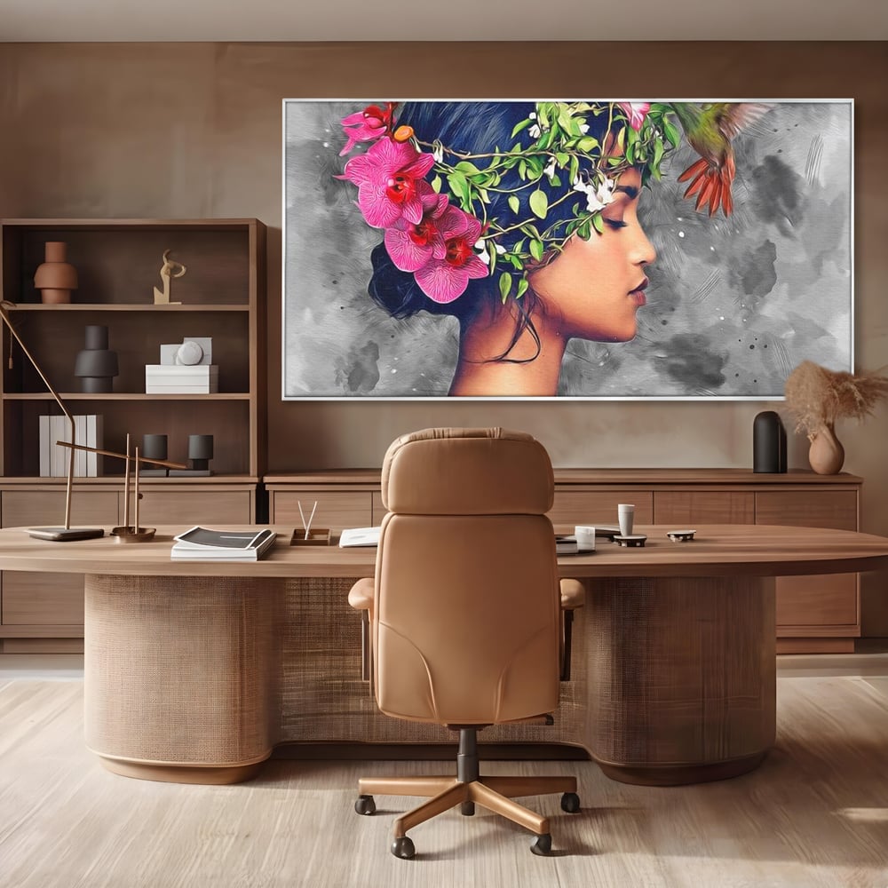Tablou canvas cu tablou canvas cu portret de femeie si colibri, in rama de aluminiu argintiu, pe perete intr-un birou